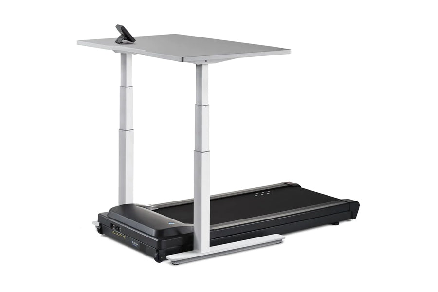 LifeSpan TR5000-Omni Desk Treadmill with black running belt, gray desktop surface, and adjustable white metal frame on white 