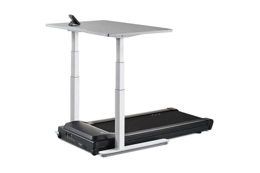 LifeSpan TR5000-Omni Desk Treadmill with black running belt, gray desktop surface, and adjustable white metal frame on white 