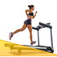 Woman running on LifeSpan TR6000i treadmill with yellow base, wearing black sports bra and shorts with purple sneakers