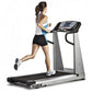 Woman running on True Z5.0 treadmill with digital display, black belt and silver frame, worn by model on white background