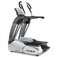 TRUE ES700 elliptical machine with white and gray frame, black handles, digital display console, and foot pedals on white bac