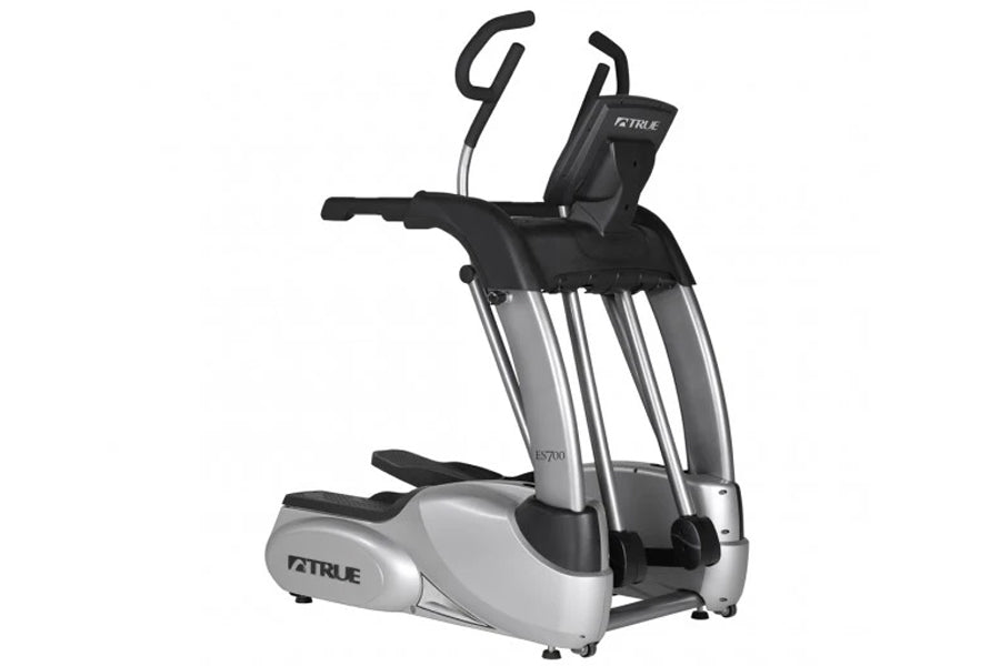 TRUE ES700 elliptical machine with silver and black frame, dual handles, and digital display on white background