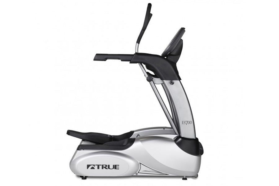TRUE ES700 elliptical machine with silver frame, black handles and footrest on white background