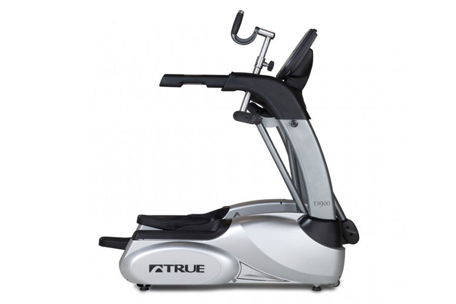 TRUE ES900 elliptical machine with silver and black frame, featuring extended handles and foot pedals on white background