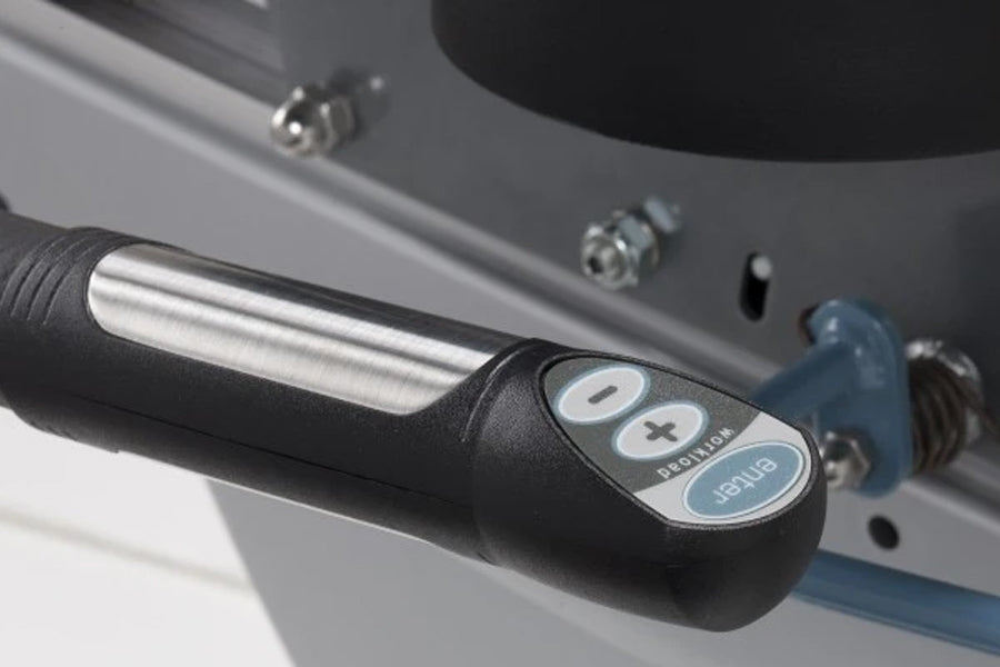 Black and silver handlebar control with preset buttons and blue grip on TRUE recumbent exercise bike