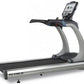 TRUE ES900 commercial treadmill with digital console display and black running deck on silver frame, on white background