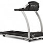 True M30 treadmill with black and silver frame, curved handrails, and digital console on white background