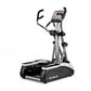 TRUE M50 elliptical machine with silver frame, black foot pedals, dual handles, and digital display console on white backgrou