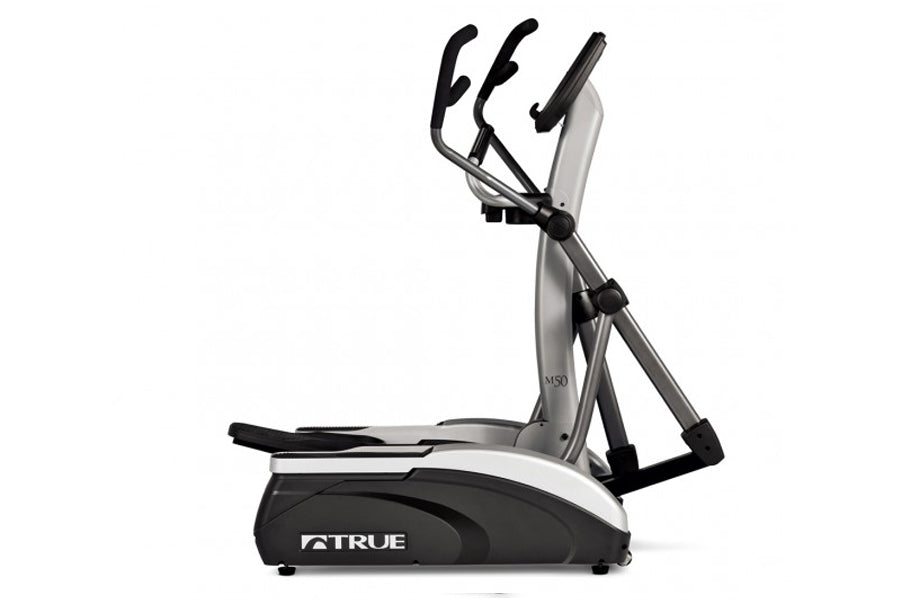 TRUE M50 elliptical machine with black foot pedals and silver frame on white background