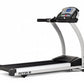 TRUE M50 treadmill with black running belt, white frame, digital console, and dual handrails on white background