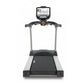 TRUE PS825 treadmill with black running deck, silver frame, and digital console display mounted on handlebar against white ba