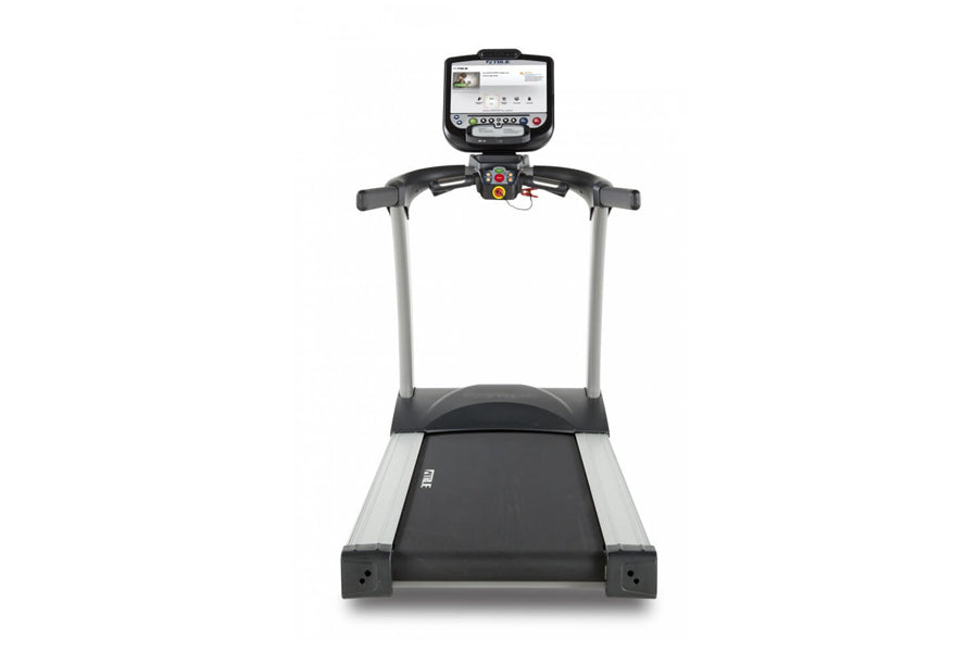 TRUE PS825 treadmill with black running deck, silver frame, and digital console display mounted on handlebar against white ba