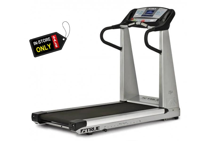 TRUE Z5.0 treadmill with black running deck, silver frame, dual handrails, and digital display console on white background