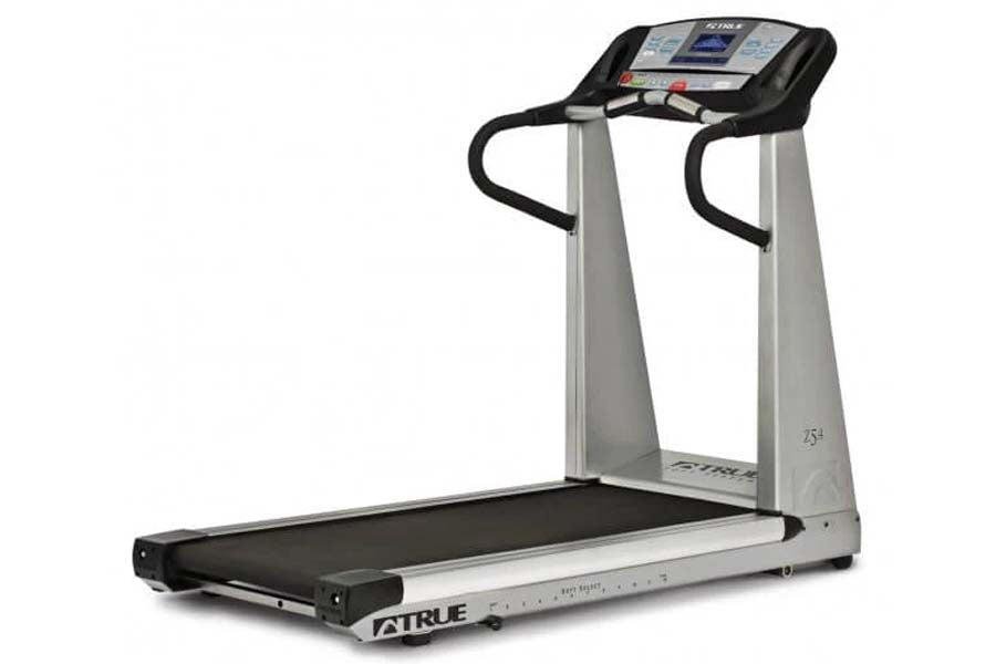 TRUE Z5.4 treadmill with silver uprights, black running belt, and digital console display on white background
