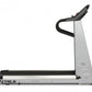 TRUE Z5.4 treadmill with black and silver frame, curved running belt, and black handlebar on white background