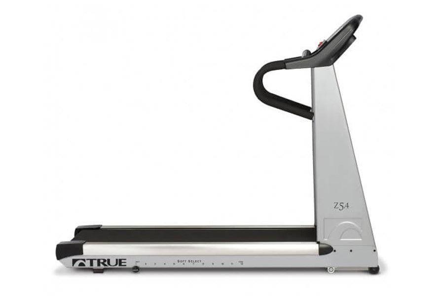 TRUE Z5.4 treadmill with black and silver frame, curved running belt, and black handlebar on white background