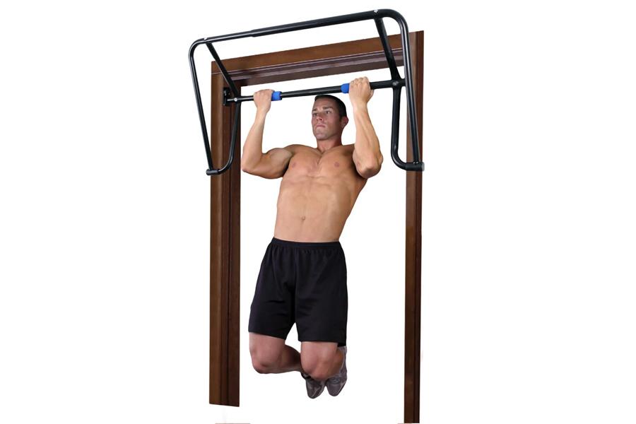 Teeter EZ-Ups inversion and chin-up rack with wooden frame and black metal bar, man performing pull-up exercise