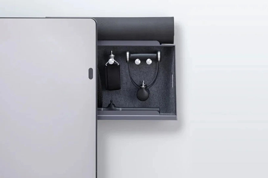 Lululemon Studio Mirror Plus with open drawer displaying black wireless earbuds, charging case, and accessories on gray felt 