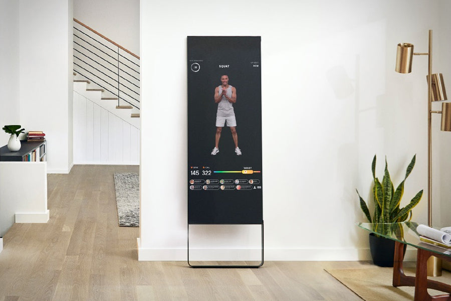 Lululemon Studio Mirror Plus with black screen displaying fitness workout interface and instructor performing squat exercise
