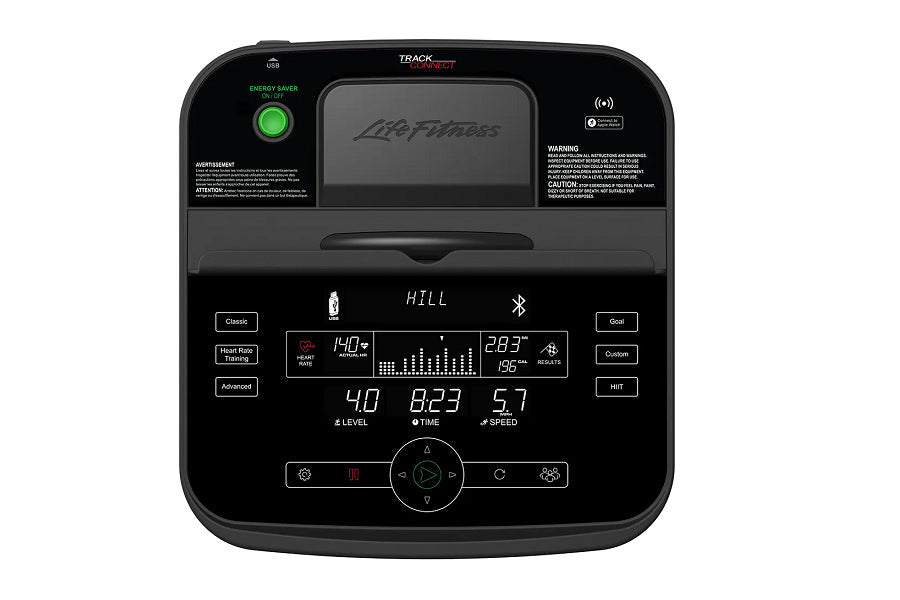 Life Fitness T3 treadmill with digital display showing hill workout metrics, control panel with buttons, and green energy sav