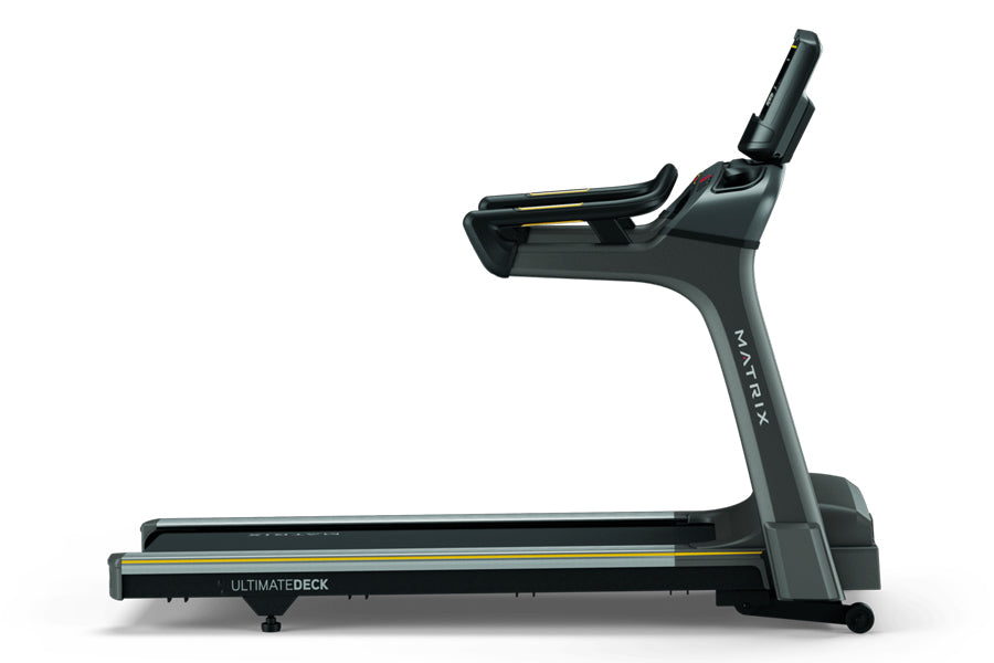 Matrix T75 black treadmill with gray frame and gold accents, shown in side view on white background