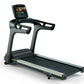 Black and gray motorized treadmill with digital touchscreen display, dual handles, and black running belt on white background