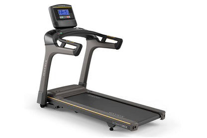 Matrix TF30 folding treadmill with gray and black frame, digital display console, dual handles, and black running deck on whi