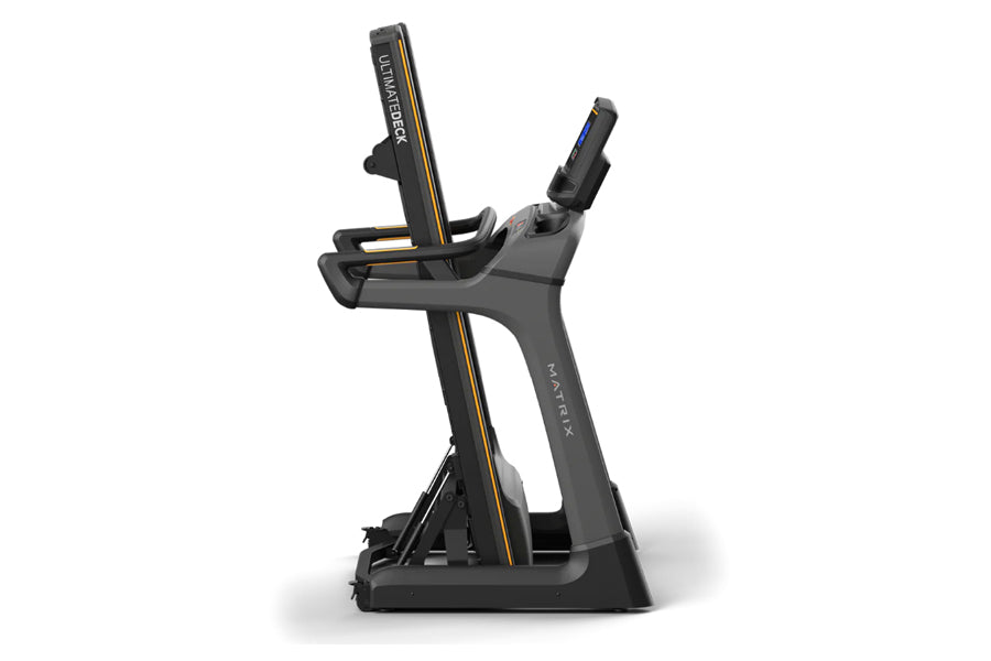 Matrix TF30 folding treadmill with black frame, gold accents, digital console, and handrail controls on white background