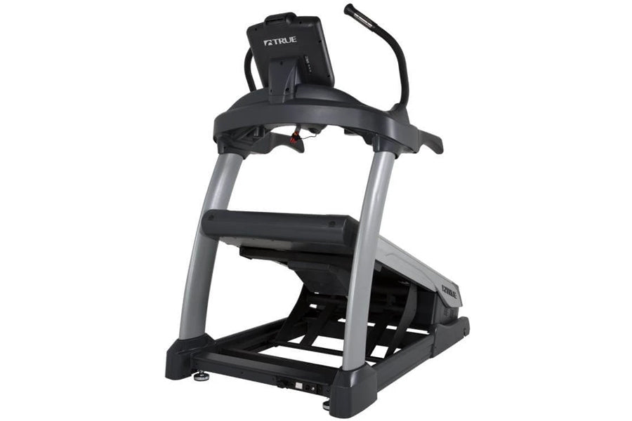 Black and silver True Alpine Runner treadmill with digital console, handrails, and black foot platform on white background
