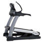 TRUE Alpine Runner Treadmill with gray and black frame, dual handles, and digital display on white background