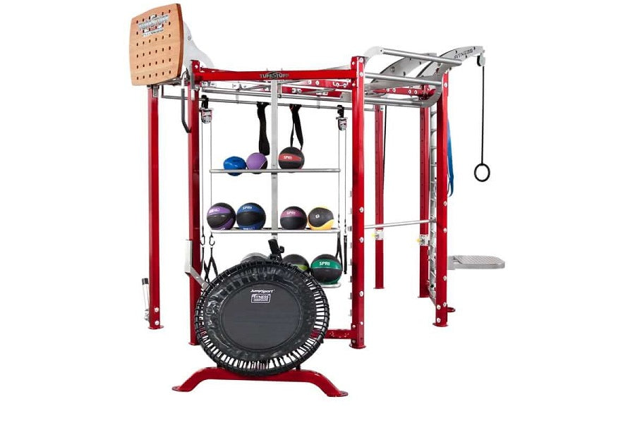 Red and silver multi-station fitness trainer with rebounder trampoline, cable machine attachments, weight storage shelves hol