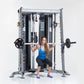 Woman in blue tank top performing squat exercise on gray and black Smith press machine with weighted barbell