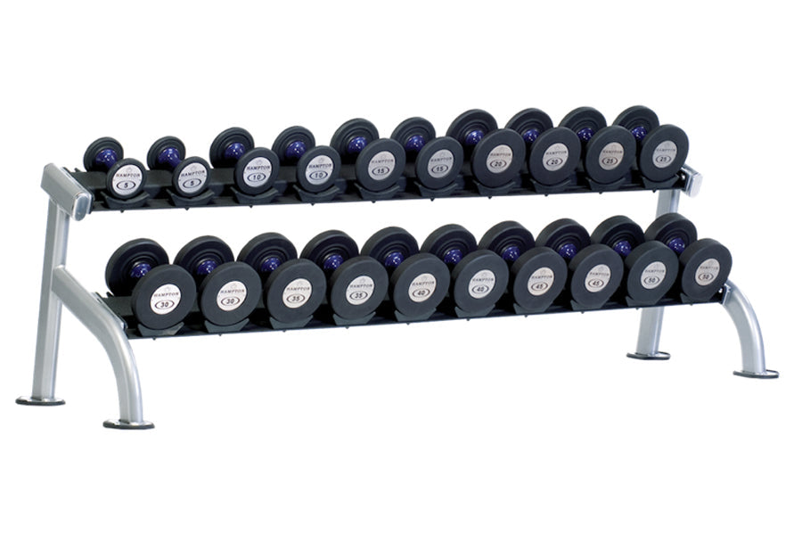 Two-tier dumbbell rack with silver metal frame holding black rubber-coated dumbbells with white and blue labels, arranged in 