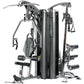 TuffStuff Apollo 7300 three-station multi-gym with black and silver frame, featuring multiple exercise stations with weight s