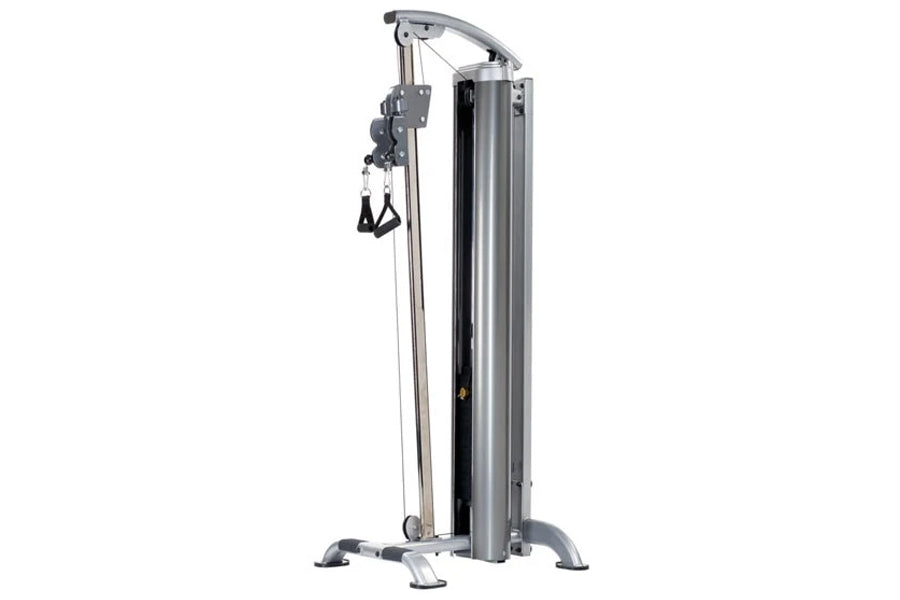 TuffStuff Apollo 7300 multi-gym system with gray metal frame, cable pulley attachment, and dual black foot handles on white b