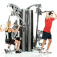 TuffStuff Apollo 7300 three-station multi-gym system with silver steel frame, two people demonstrating different exercises on