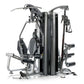 TuffStuff Apollo 7400 4-station multi-gym system with black padded seats, silver metal frame, and multiple exercise stations 