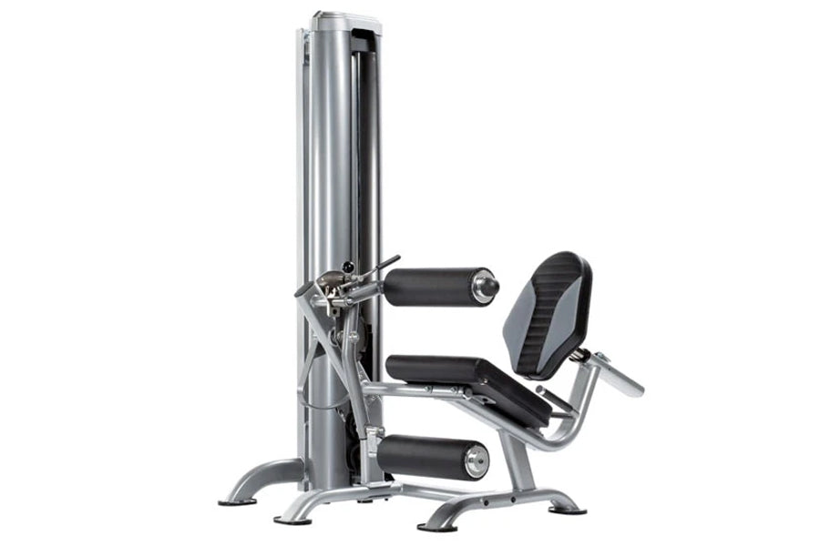 Silver and black 4-station multi gym system with stacked weight machine, leg press station, and padded seat on white backgrou