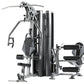 TuffStuff Apollo 7200 multi-station gym system with black and silver frame, featuring dual workout stations with leg press an