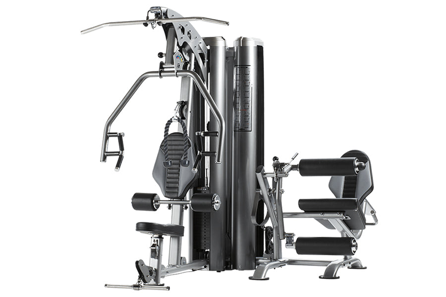 TuffStuff Apollo 7200 multi-station gym system with black and silver frame, featuring dual workout stations with leg press an