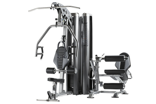 TuffStuff Apollo 7200 multi-station gym system with black and silver frame, featuring dual workout stations with leg press an