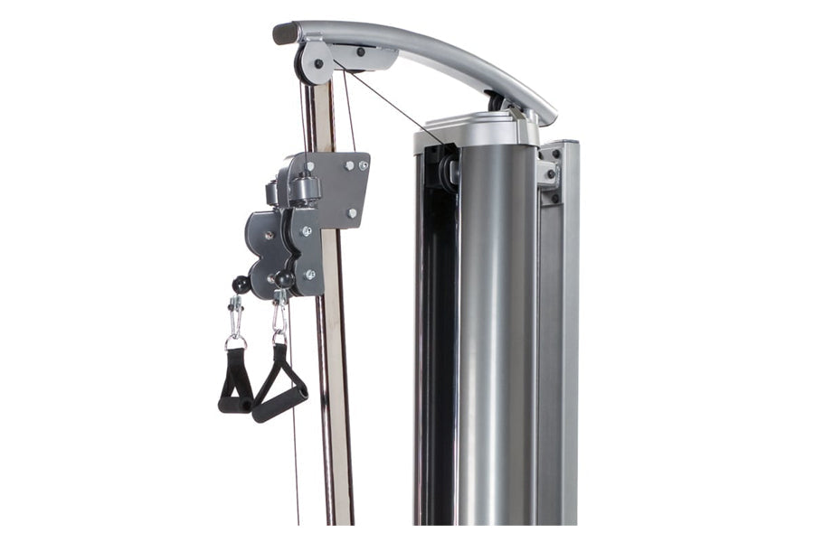 TuffStuff Apollo 7000 high-low pulley station with gray metal frame, dual black foot straps, and adjustable cable system on w
