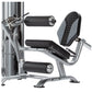 TuffStuff Apollo leg extension and curl machine with silver steel frame, black padded seat and leg pads on white background