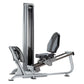 TuffStuff Apollo leg press machine with silver frame, black padded seat and backrest, and vertical weight stack on white back