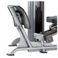 Silver and black leg press machine with padded seat and footplate on white background