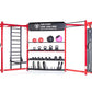 Red and black TuffStuff modular gym system with storage shelves, weight plates, kettlebells, medicine balls, and cable machin