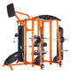 Orange and black multi-station fitness training system with cable machines, weight stack, and attached trampoline on white ba