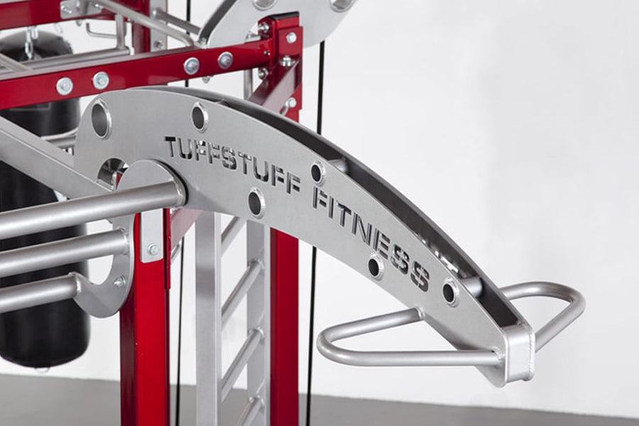 TuffStuff Fitness red and silver multi-station training system with metal frame and handles on white background