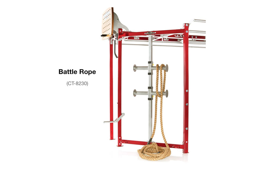 Red metal fitness trainer with rope attachment system and tan battle rope coiled at base on white background