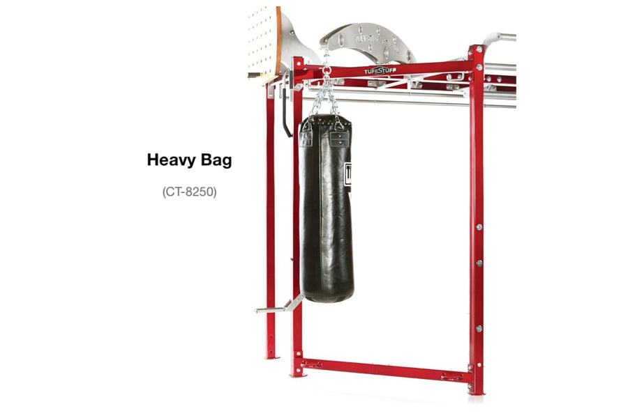 Red heavy bag stand with black cylindrical punching bag suspended from rotating mount on white background